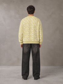 Model wearing the SM Abstract Jacquard Knitted Cardigan in Natural Flax, rear view.