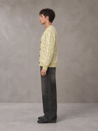 Model wearing the SM Abstract Jacquard Knitted Cardigan in Natural Flax, side profile.