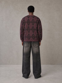 Model wearing the SM Argyle Jacquard Knitted Sweatshirt in Burgundy, rear view.