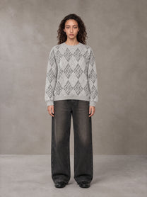 Model wearing the SM Argyle Jacquard Knitted Sweatshirt in Polished Silver, front view.