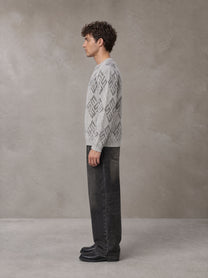 Model wearing the SM Argyle Jacquard Knitted Sweatshirt in Polished Silver, side profile.