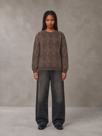 Model wearing the SM Argyle Jacquard Knitted Sweatshirt in Deep Coffee, front view.
