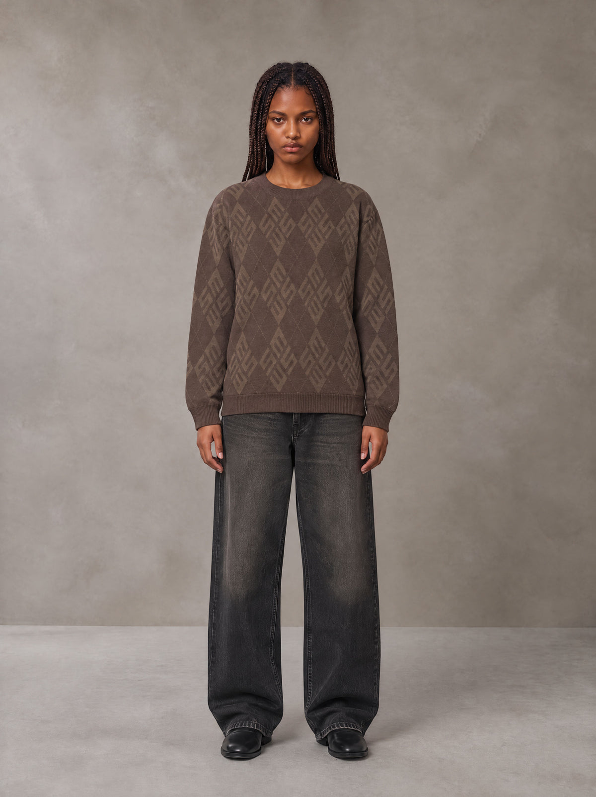 Model wearing the SM Argyle Jacquard Knitted Sweatshirt in Deep Coffee, front view.