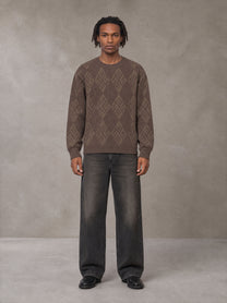 Model wearing the SM Argyle Jacquard Knitted Sweatshirt in Deep Coffee, front view.