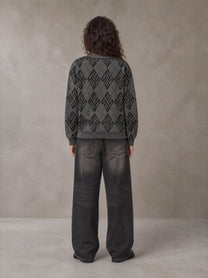 Model wearing the SM Argyle Jacquard Knitted Sweatshirt in Deep Charcoal, rear view.