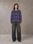 Model wearing the SM Argyle Jacquard Knitted Sweatshirt in Violet, front view.