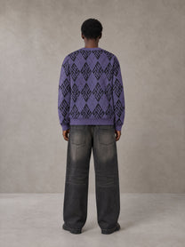 Model wearing the SM Argyle Jacquard Knitted Sweatshirt in Violet, rear view.