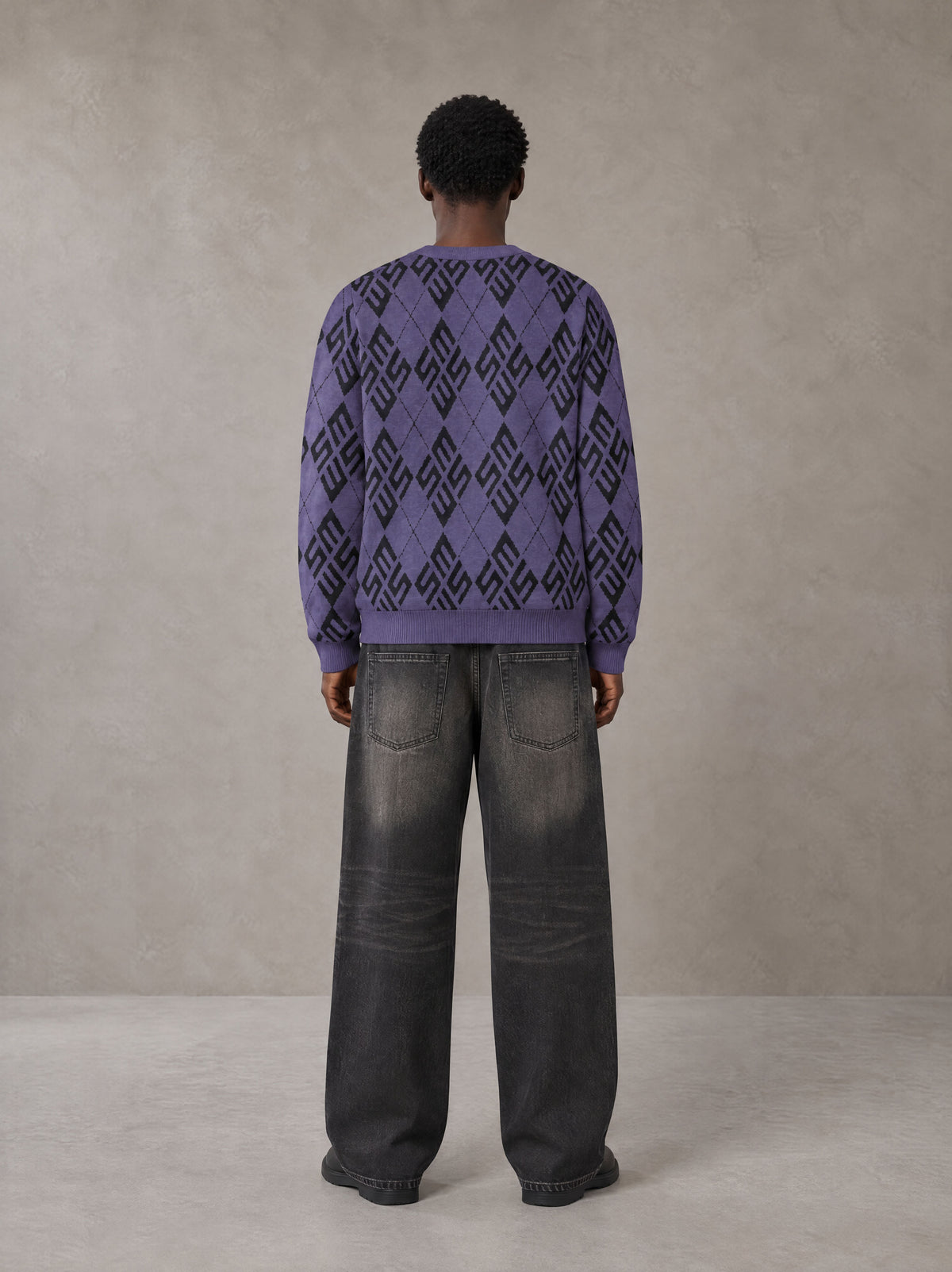 Model wearing the SM Argyle Jacquard Knitted Sweatshirt in Violet, rear view.