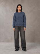 Model wearing the SM Jacquard Knitted Sweatshirt in Chambray, front view.