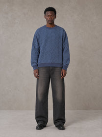 Model wearing the SM Jacquard Knitted Sweatshirt in Chambray, front view.