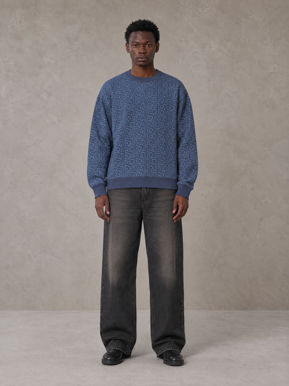 Model wearing the SM Jacquard Knitted Sweatshirt in Chambray, front view.