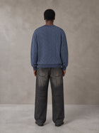 Model wearing the SM Jacquard Knitted Sweatshirt in Chambray, rear view.