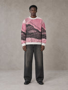 Model wearing the SM Seascape Jacquard Knitted Sweatshirt in Blush Rose, front view.