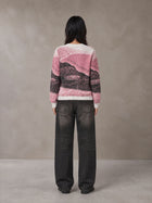 Model wearing the SM Seascape Jacquard Knitted Sweatshirt in Blush Rose, rear view.