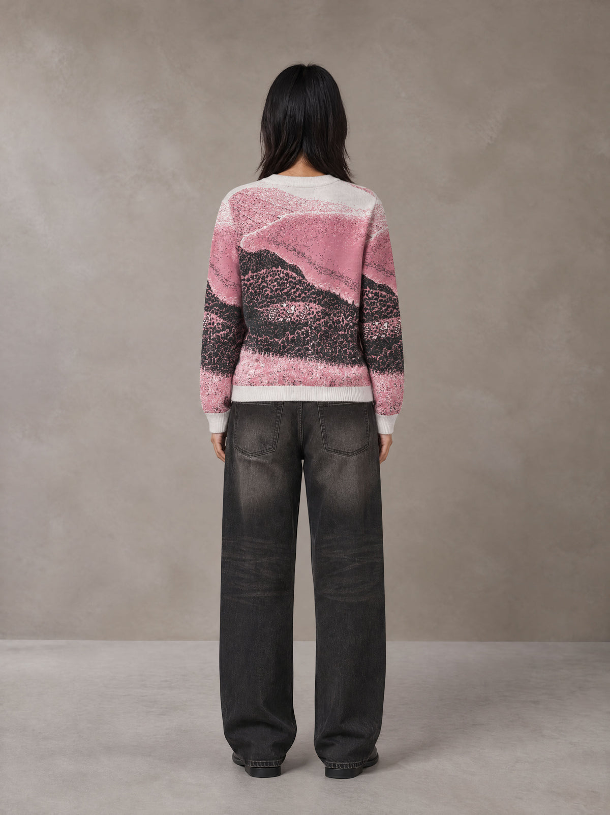 Model wearing the SM Seascape Jacquard Knitted Sweatshirt in Blush Rose, rear view.