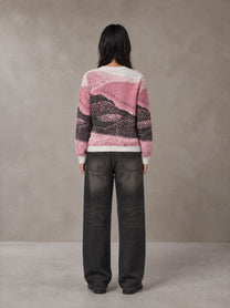 Model wearing the SM Seascape Jacquard Knitted Sweatshirt in Blush Rose, rear view.