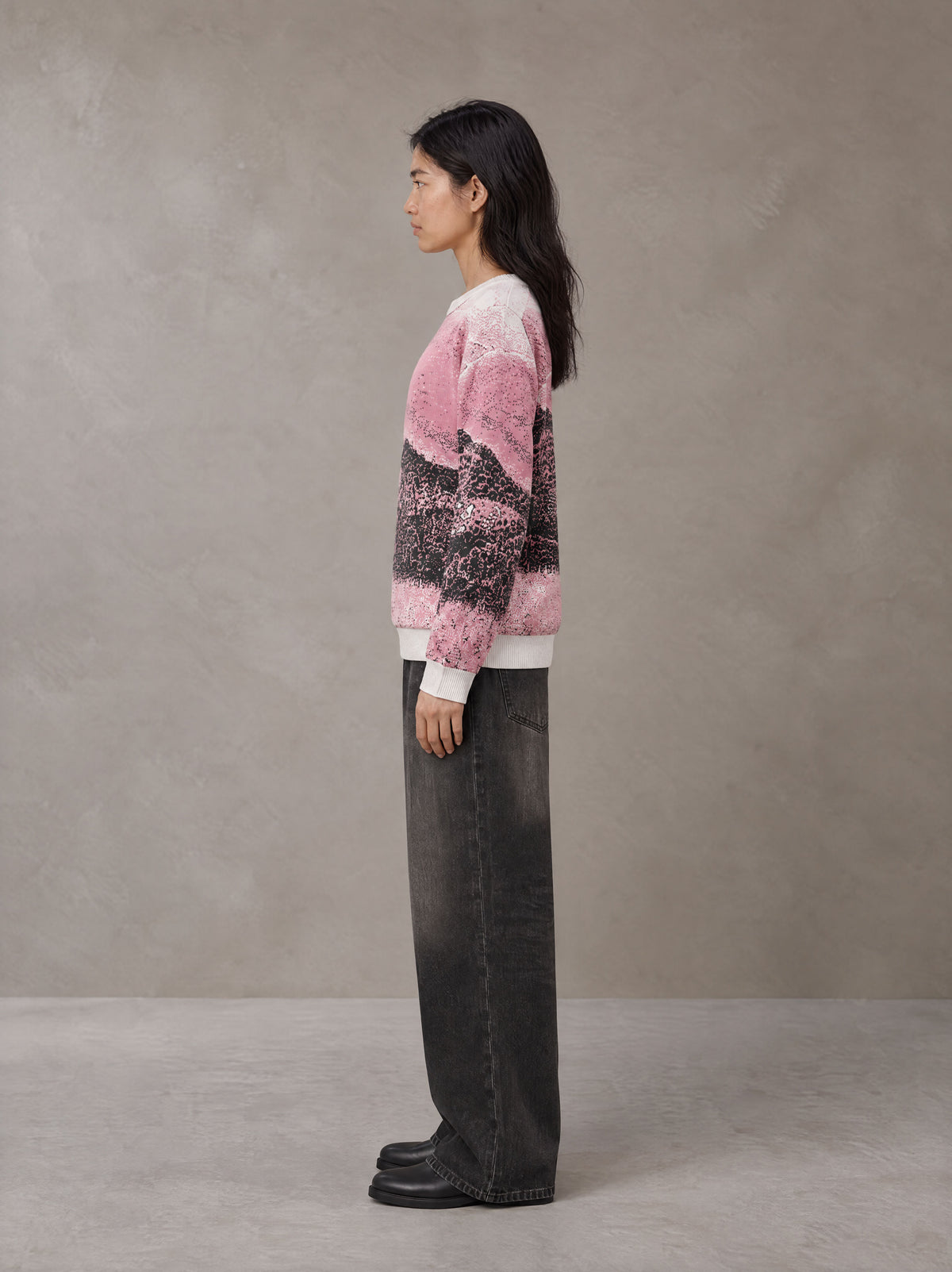 Model wearing the SM Seascape Jacquard Knitted Sweatshirt in Blush Rose, side profile.