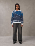 Model wearing the SM Seascape Jacquard Knitted Sweatshirt in Chambray, front view.