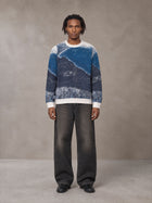 Model wearing the SM Seascape Jacquard Knitted Sweatshirt in Chambray, front view.