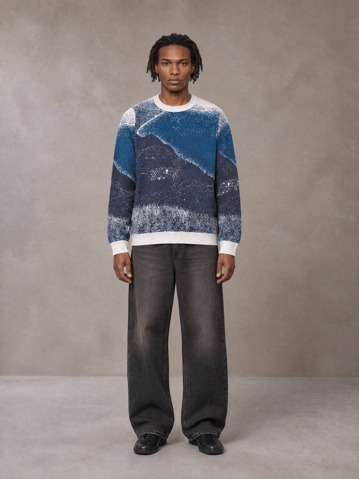 Model wearing the SM Seascape Jacquard Knitted Sweatshirt in Chambray, front view.