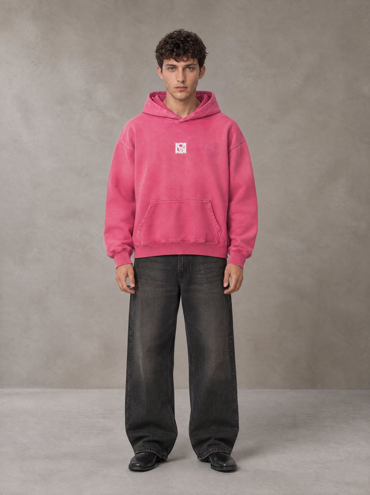 Model wearing the SM Monkey Wash Hoodie in Vivid Pink, front view.