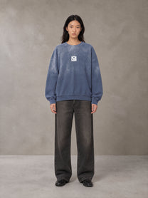 Model wearing the SM Monkey Wash Sweatshirt in Chambray, front view.