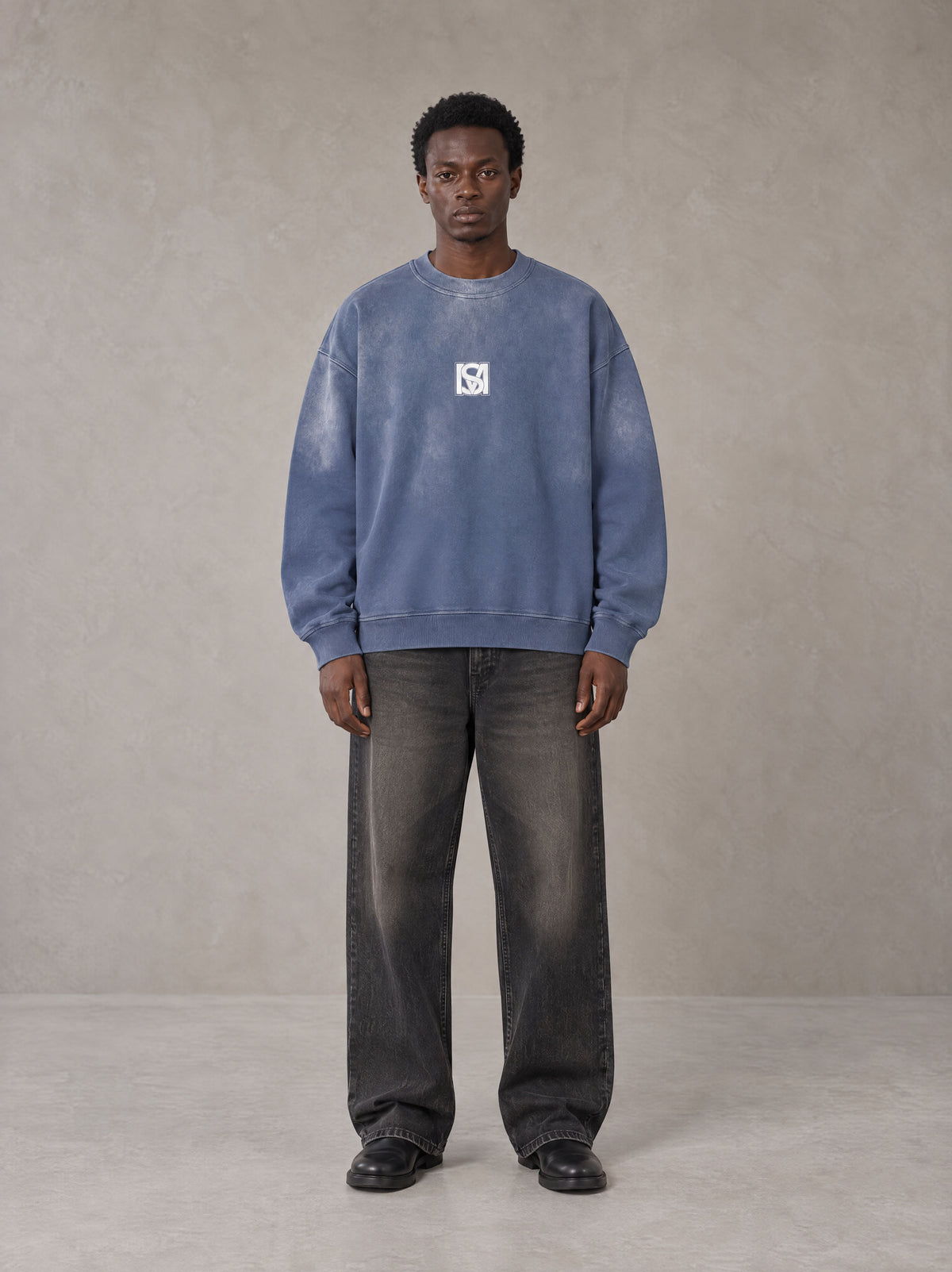 Model wearing the SM Monkey Wash Sweatshirt in Chambray, front view.