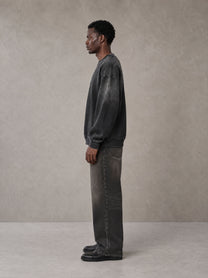 Model wearing the SM Monkey Wash Sweatshirt in Midnight Black, side profile.