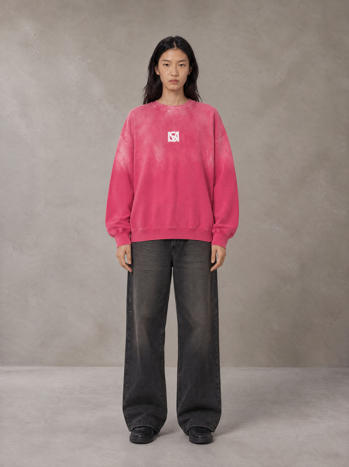 Model wearing the SM Monkey Wash Sweatshirt in Vivid Pink, front view.