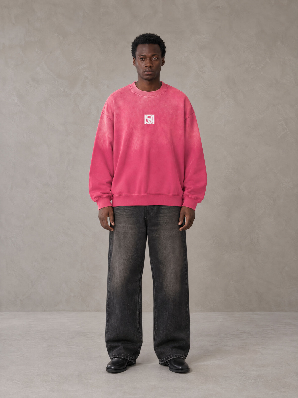 Model wearing the SM Monkey Wash Sweatshirt in Vivid Pink, front view.