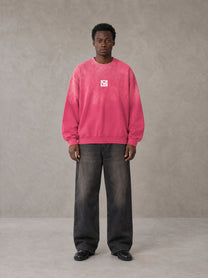 Model wearing the SM Monkey Wash Sweatshirt in Vivid Pink, front view.
