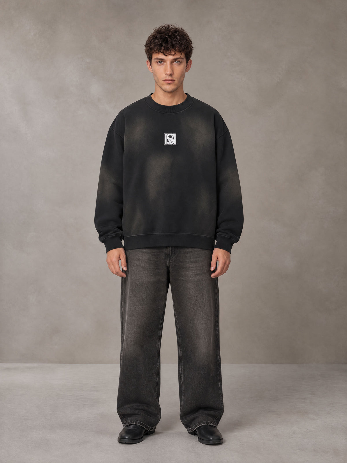 Model wearing the SM Monkey Washed Fleece Sweatshirt in Midnight Black, front view.