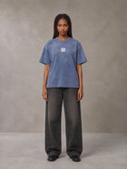 Model wearing the SM Monkey Washed T-shirt in Chambray, front view.