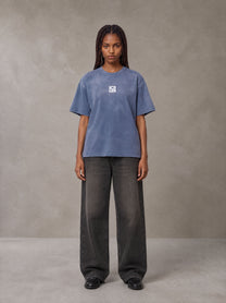 Model wearing the SM Monkey Washed T-shirt in Chambray, front view.