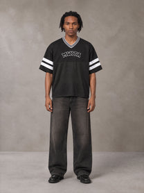 Model wearing the SM Varsity Spirit T-shirt in Midnight Black, front view.