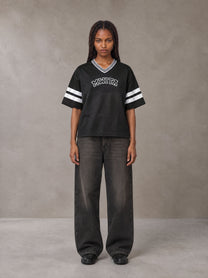 Model wearing the SM Varsity Spirit T-shirt in Midnight Black, front view.