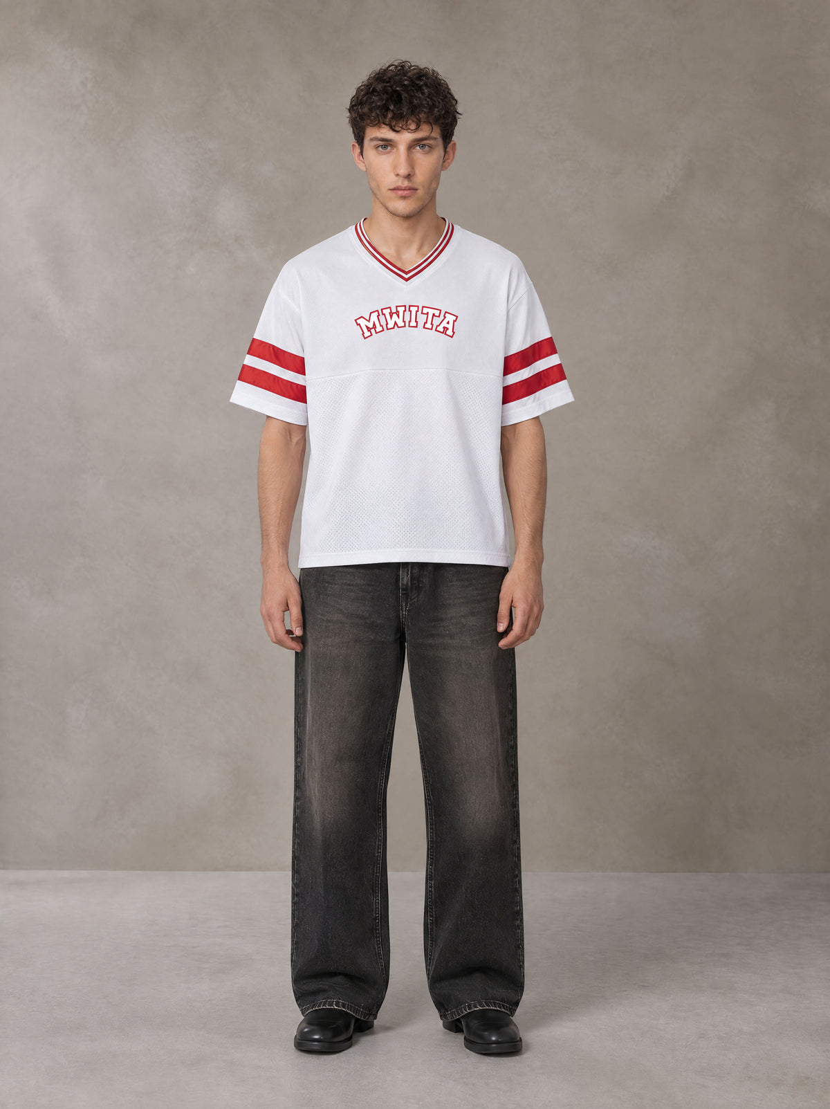 Model wearing the SM Varsity Spirit T-shirt in Lucent White, front view.