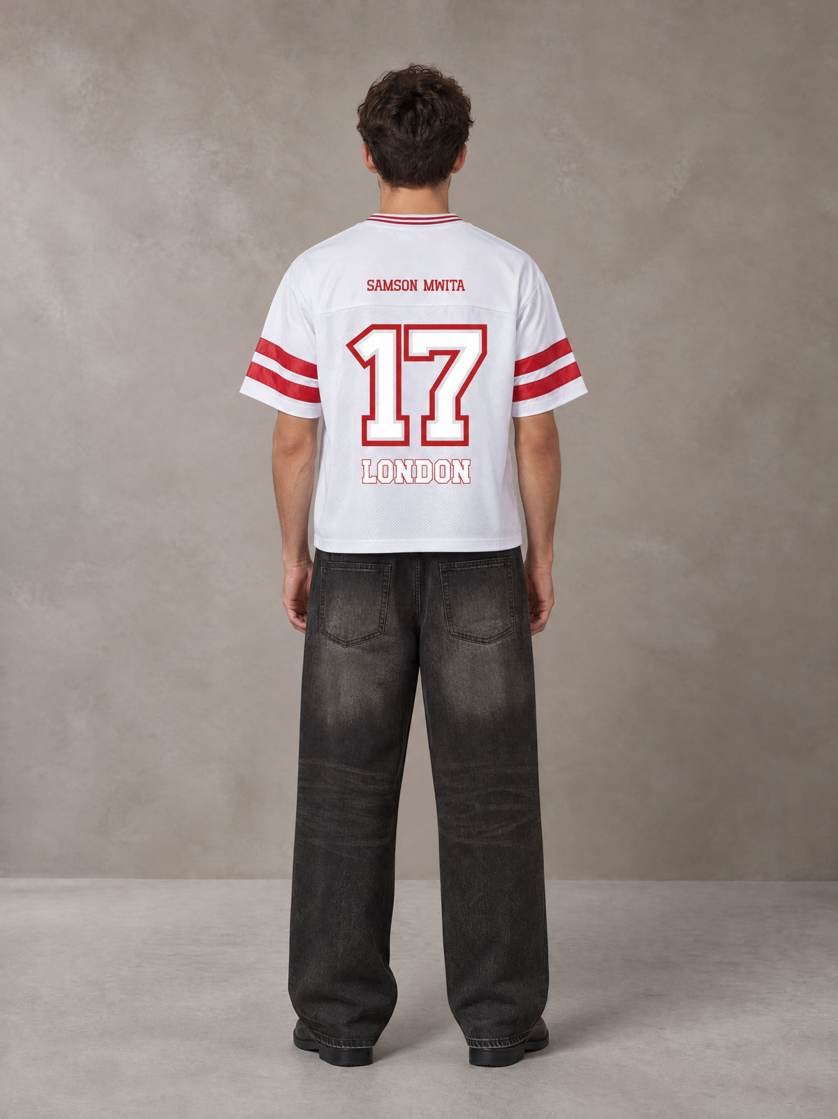 Model wearing the SM Varsity Spirit T-shirt in Lucent White, rear view.