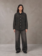 Model wearing the SM Washed Atelier Overshirt in Midnight Black, front view.