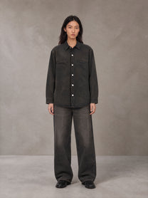 Model wearing the SM Washed Atelier Overshirt in Midnight Black, front view.