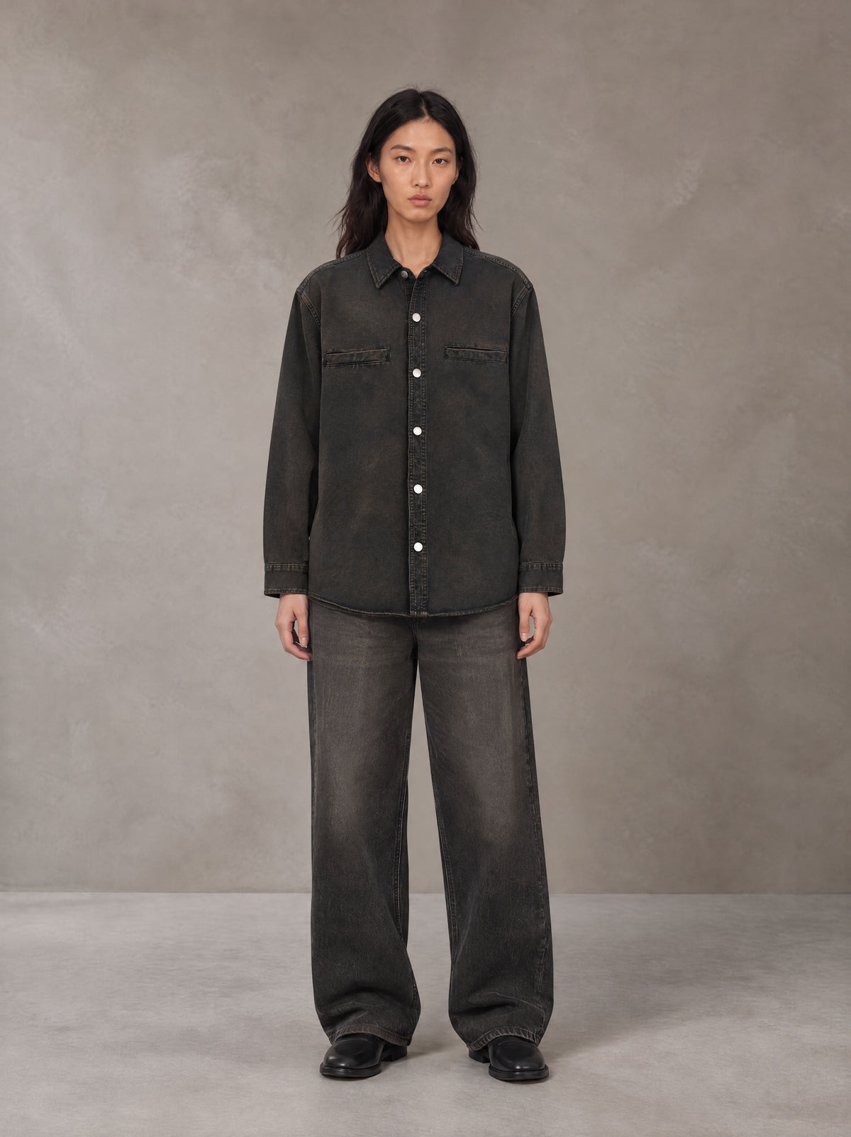 Model wearing the SM Washed Atelier Overshirt in Midnight Black, front view.