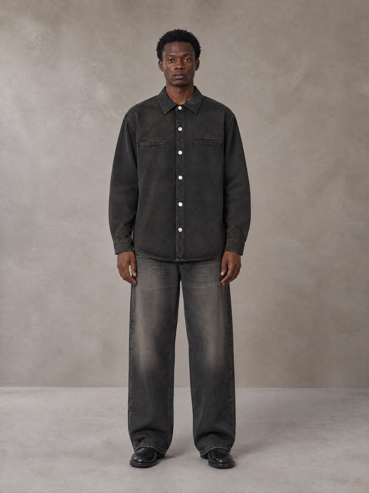 Model wearing the SM Washed Atelier Overshirt in Midnight Black, front view.