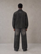 Model wearing the SM Washed Atelier Overshirt in Midnight Black, rear view.