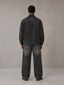 Model wearing the SM Washed Atelier Overshirt in Midnight Black, rear view.