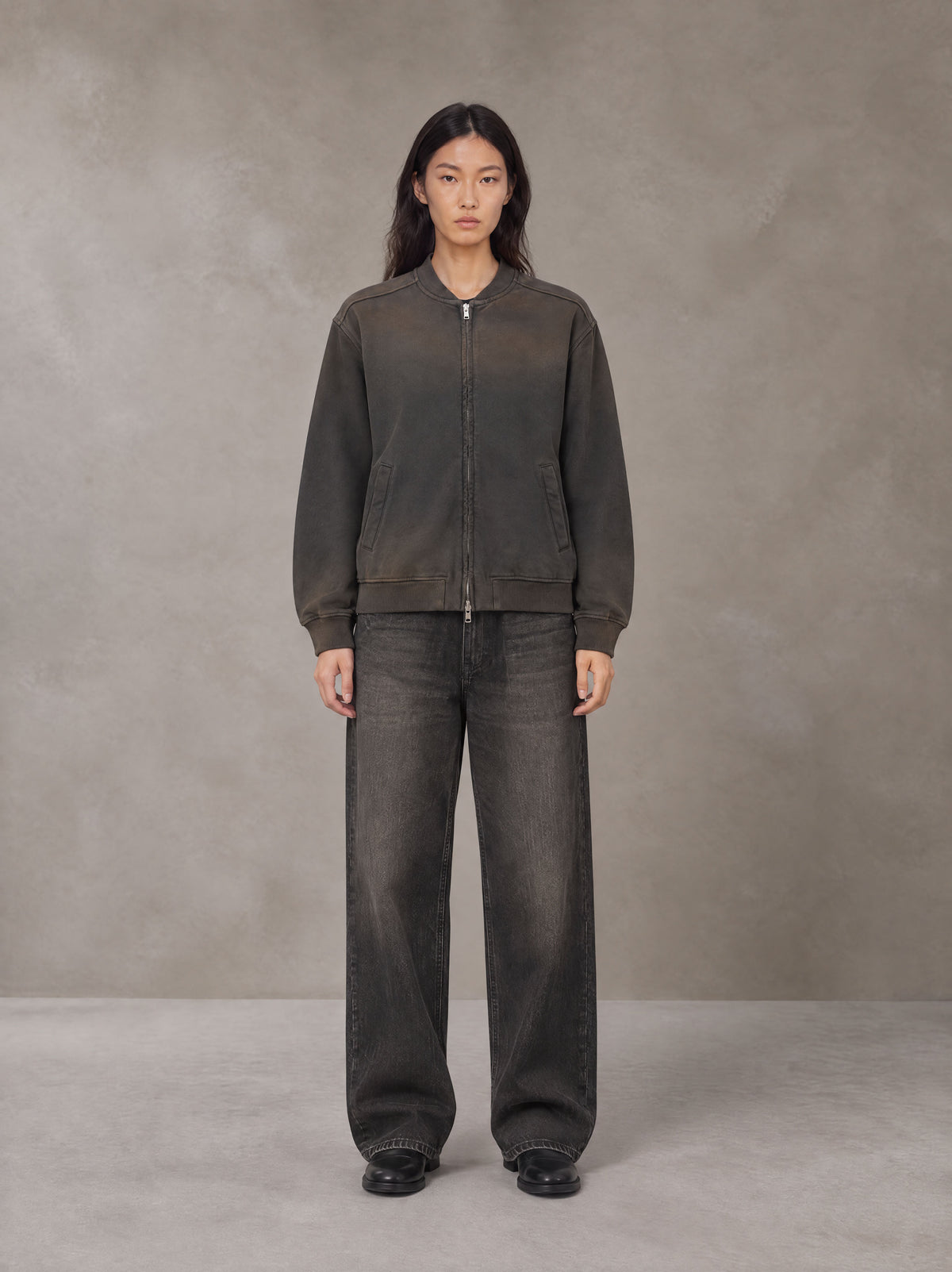 Model wearing the SM Sig. Shadow Fade Bomber Jacket in Ashen Grey, front view.