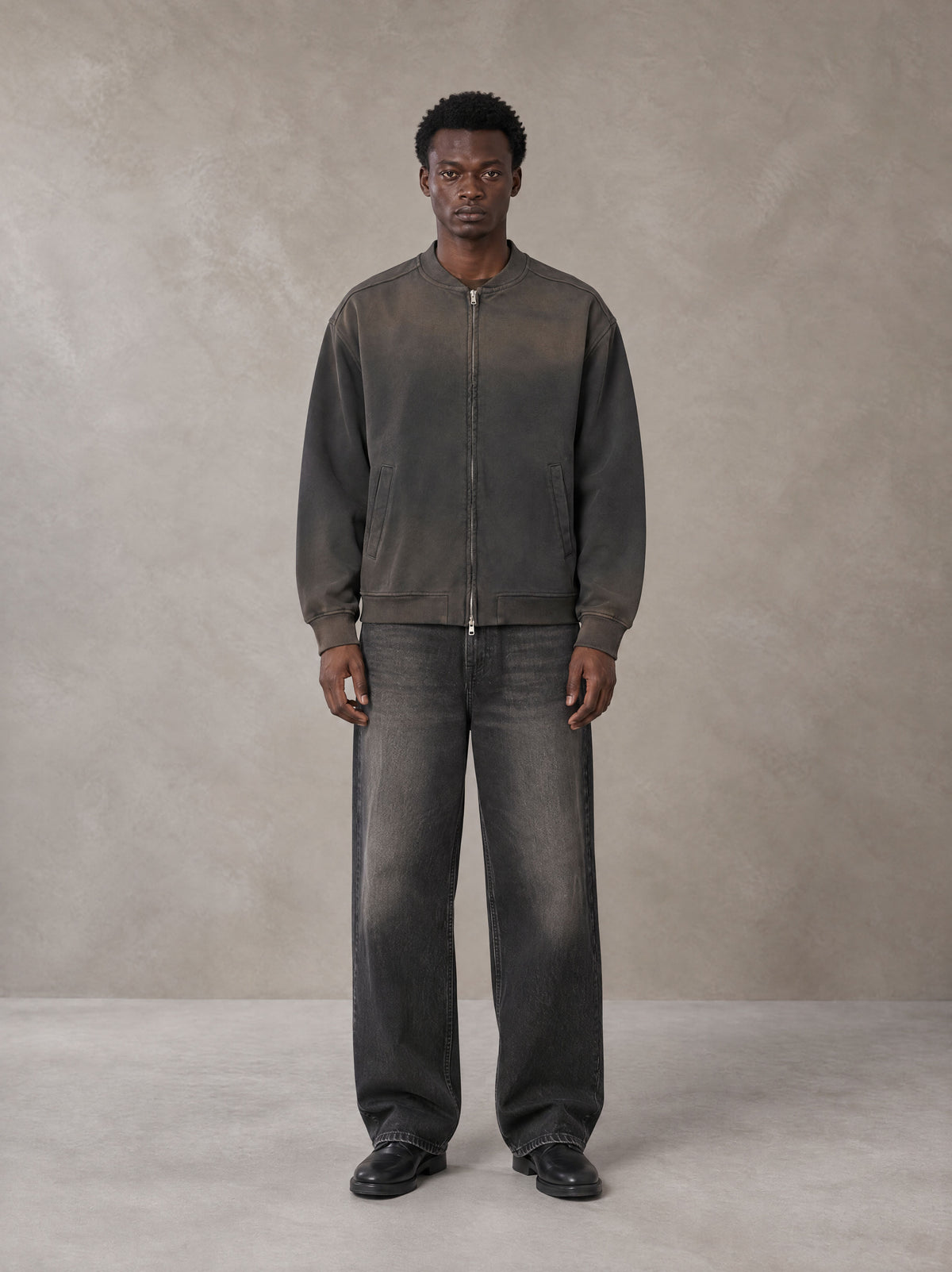 Model wearing the SM Sig. Shadow Fade Bomber Jacket in Ashen Grey, front view.
