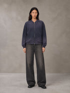 Model wearing the SM Sig. Shadow Fade Bomber Jacket in Deep Purple, front view.