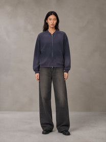 Model wearing the SM Sig. Shadow Fade Bomber Jacket in Deep Purple, front view.