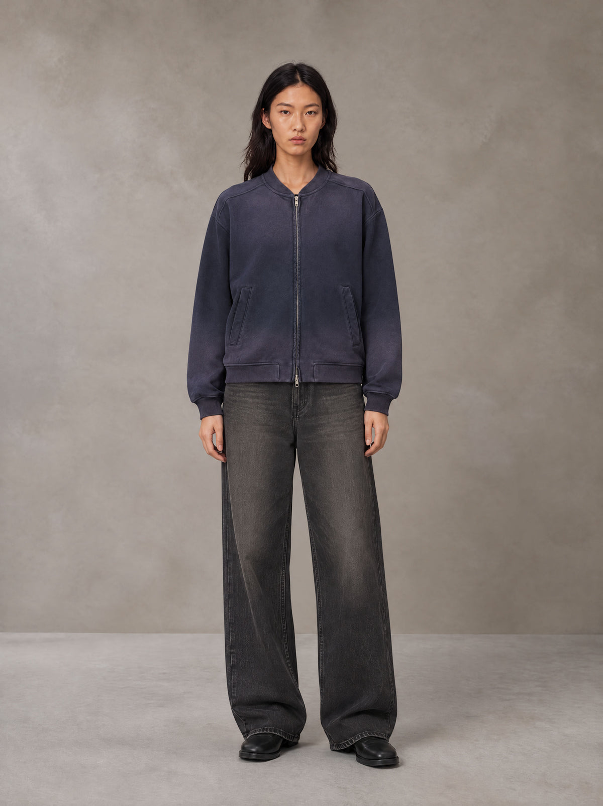 Model wearing the SM Sig. Shadow Fade Bomber Jacket in Deep Purple, front view.