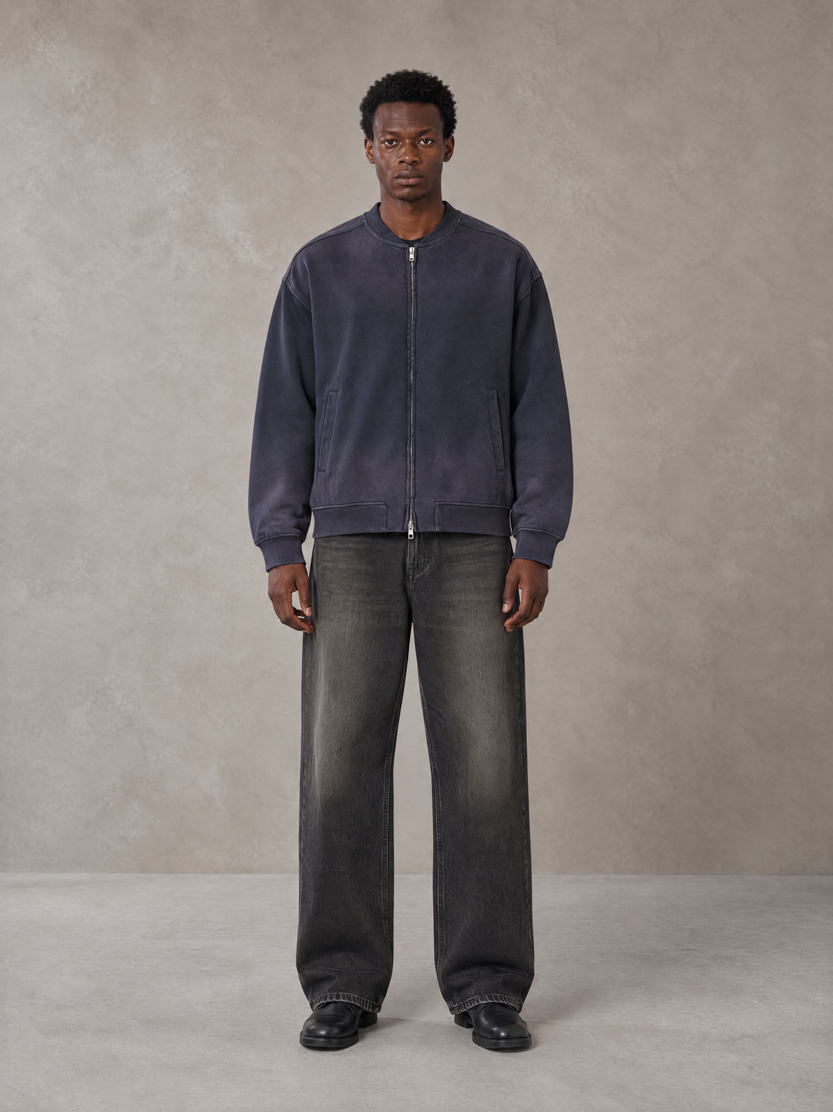 Model wearing the SM Sig. Shadow Fade Bomber Jacket in Deep Purple, front view.